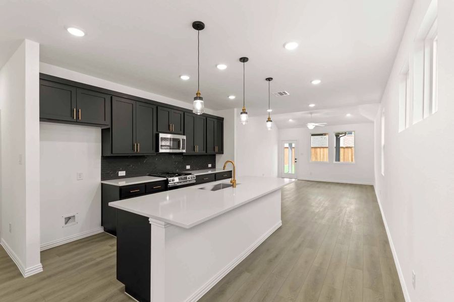 Open Kitchen-Living-Dining Room Representative Photo featuring the Noir Collection