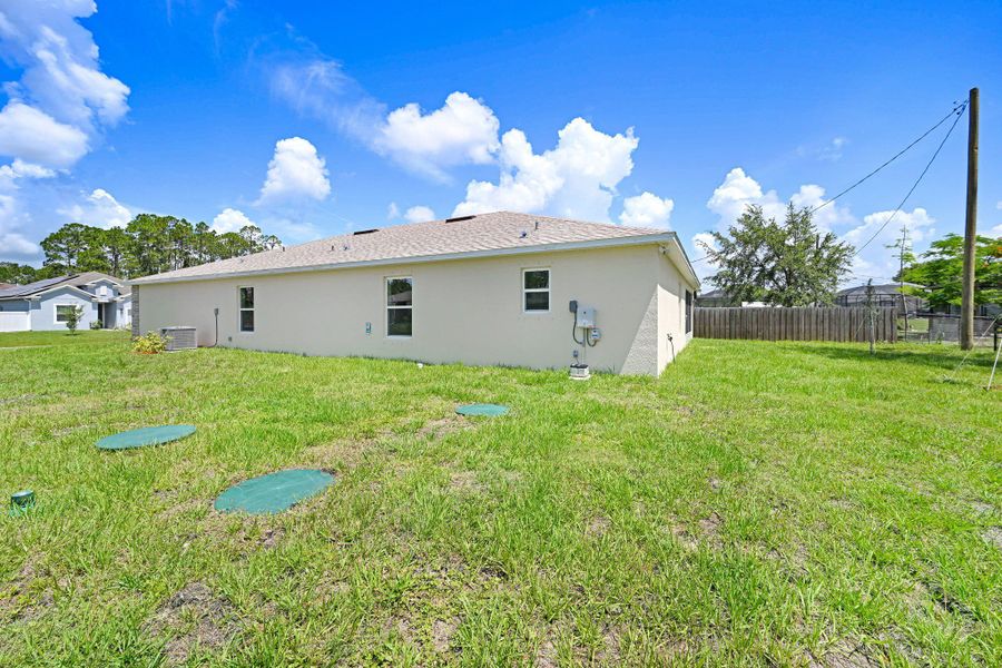 Exterior details and patio area of a home in Palm Bay & South Brevard, Palm Bay (Image 3).