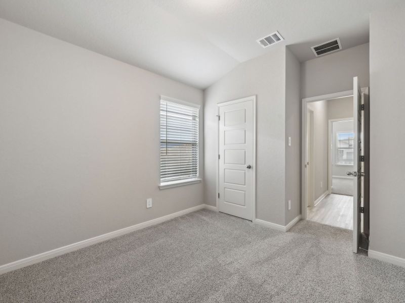 Guest bedroom in the Briscoe floorplan at a Meritage Homes community. Guest bedroom in the Briscoe floorplan at a Meritage Homes community.