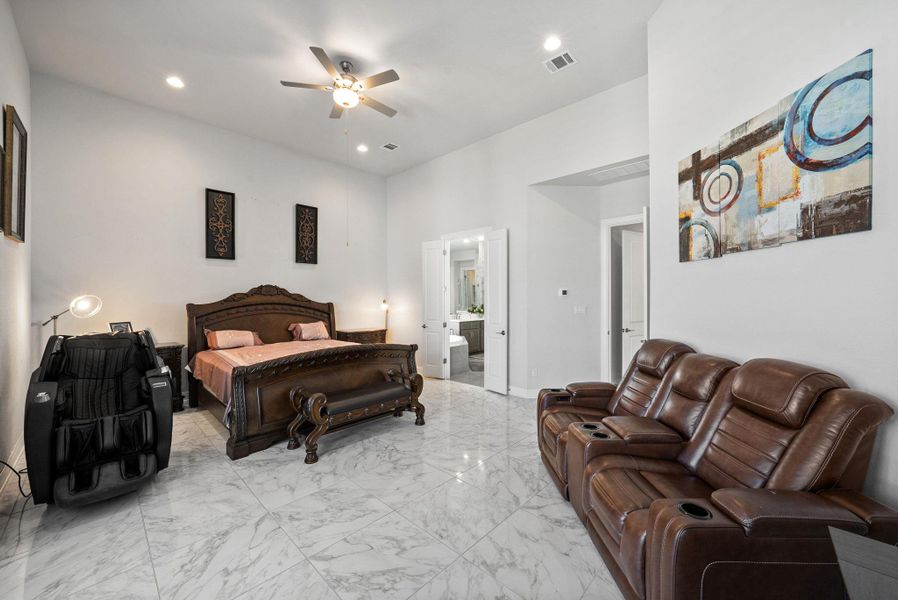 Bedroom featuring light marble finish flooring, recessed lighting, and ceiling fan