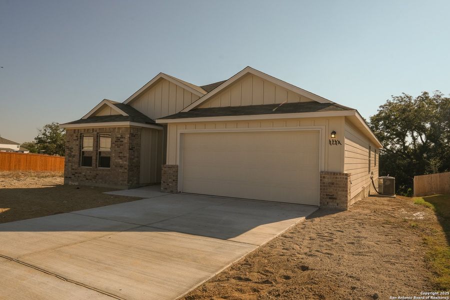 Front exterior of a new home in Cinco Lakes, San Antonio, TX, highlighting curb appeal (Image 1). Front exterior of a new home in Cinco Lakes, San Antonio, TX, highlighting curb appeal (Image 1).
