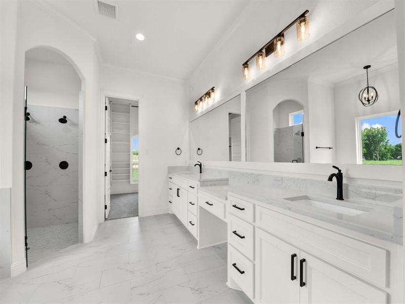 Bathroom featuring crown molding, marble look tile flooring, a marble finish shower, double vanity, and recessed lighting Bathroom featuring crown molding, marble look tile flooring, a marble finish shower, double vanity, and recessed lighting