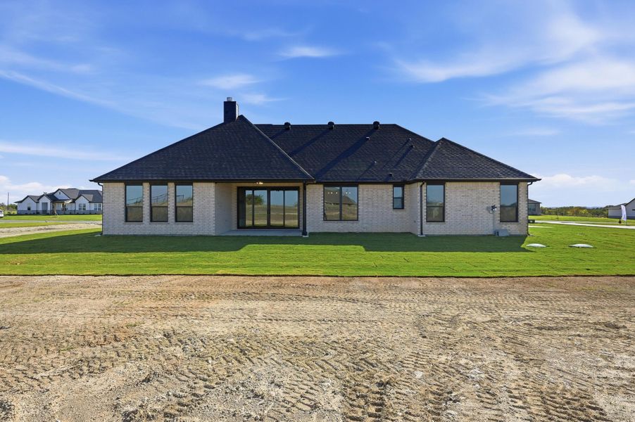 Front exterior of a new home in Rocky Top Ranch, Azle, TX, highlighting curb appeal (Image 22). Front exterior of a new home in Rocky Top Ranch, Azle, TX, highlighting curb appeal (Image 22).