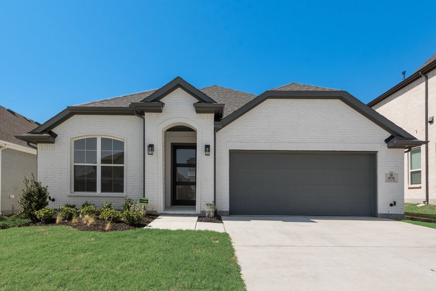 Front exterior of a new home in Tavolo Park, Fort Worth, TX, highlighting curb appeal (Image 24).