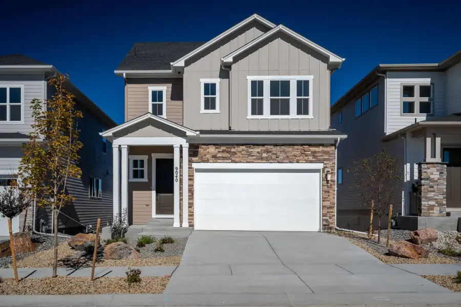 Front exterior of a new home in Revel Crossing at Wolf Ranch - The Panorama Collection, Colorado Springs, CO, highlighting curb appeal (Image 1). Front exterior of a new home in Revel Crossing at Wolf Ranch - The Panorama Collection, Colorado Springs, CO, highlighting curb appeal (Image 1).
