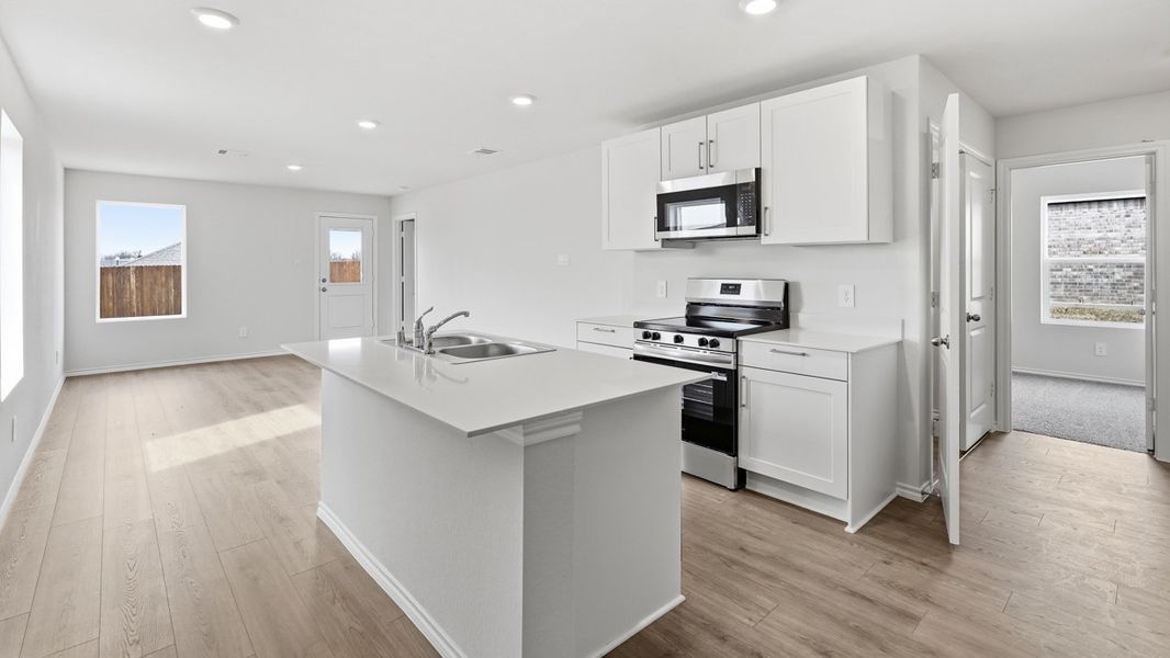 Representative furnished interior of a home built from the Atlanta by D.R. Horton in Asher Oaks, Bonham (Image 4).