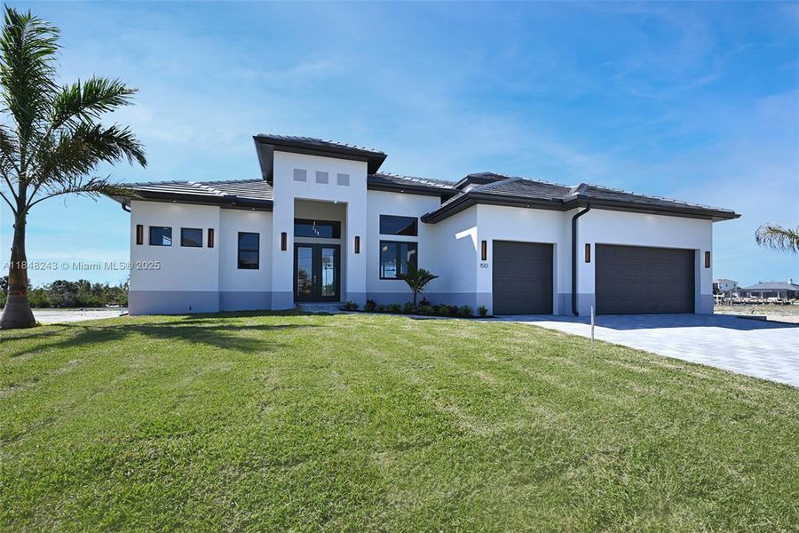 Front exterior of a new home in , Cape Coral, FL, highlighting curb appeal (Image 23). Front exterior of a new home in , Cape Coral, FL, highlighting curb appeal (Image 23).