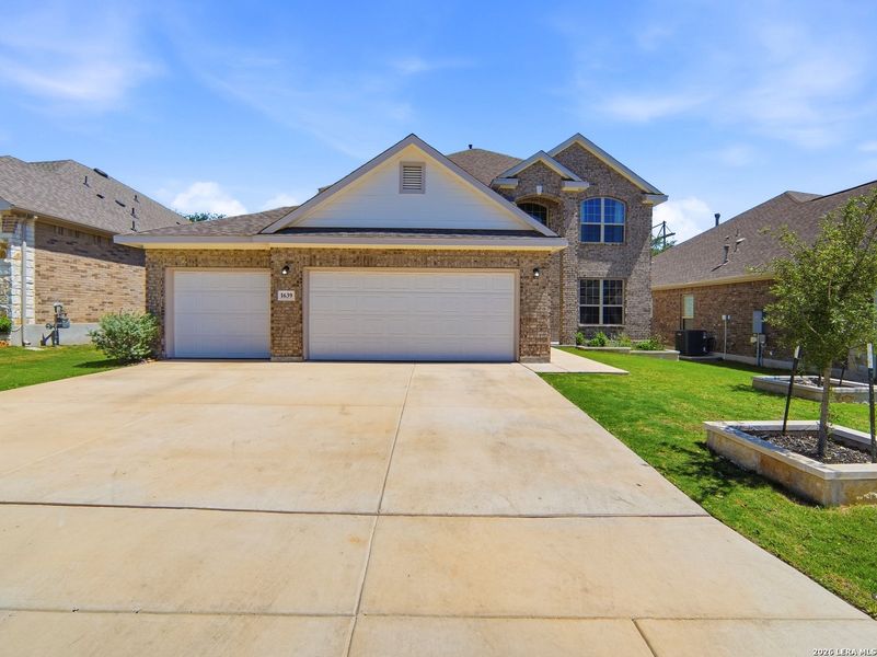 Front exterior of a new home in Ventana, Bulverde, TX, highlighting curb appeal (Image 22).