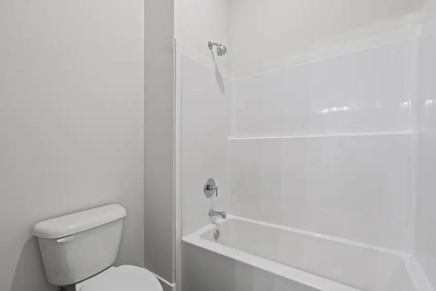 Bathroom with bathtub / shower combination and toilet