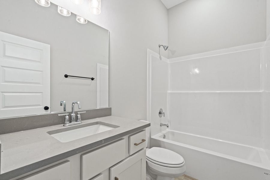 Bathroom with vanity and shower / bathtub combination