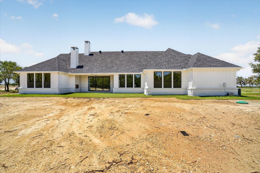 Front exterior of a new home in Timberview Preserves, Weatherford, TX, highlighting curb appeal (Image 22).