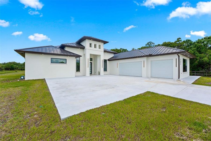 Front exterior of a new home in , Palm Bay, FL, highlighting curb appeal (Image 26). Front exterior of a new home in , Palm Bay, FL, highlighting curb appeal (Image 26).