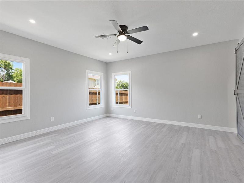 Unfurnished room featuring recessed lighting, a ceiling fan, light wood-style flooring, and baseboards Unfurnished room featuring recessed lighting, a ceiling fan, light wood-style flooring, and baseboards