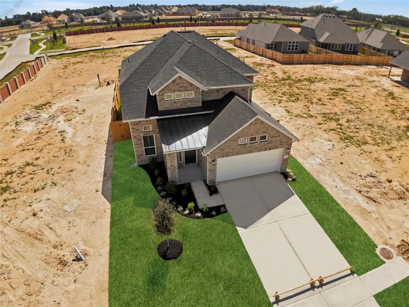 Front exterior of a new home in Wildrye, Waller, TX, highlighting curb appeal (Image 28).