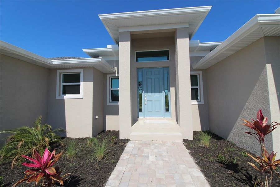 Front exterior of a new home in , Port Charlotte, FL, highlighting curb appeal (Image 11).