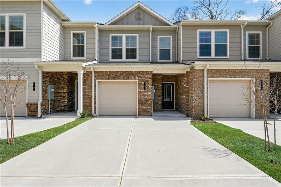 Front exterior of a new home in , South Fulton, GA, highlighting curb appeal (Image 1). Front exterior of a new home in , South Fulton, GA, highlighting curb appeal (Image 1).