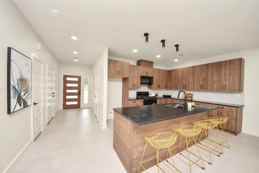 The breakfast bar offers a perfect spot for casual meals and conversation