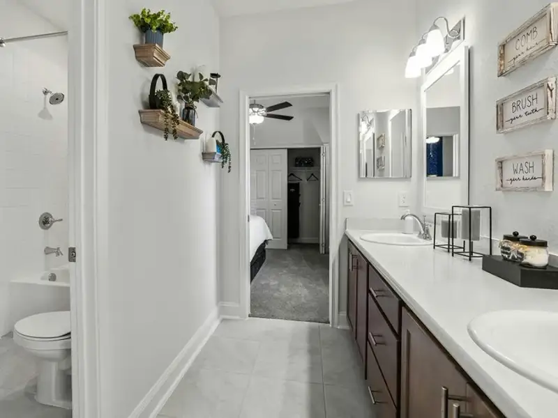 Bedrooms 2 and 3 share a dual-vanity Jack-and-Jill bath - Waylyn by Highland Homes