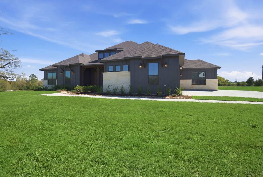 Front exterior of a new home in Chapel Bend, Montgomery, TX, highlighting curb appeal (Image 2). Front exterior of a new home in Chapel Bend, Montgomery, TX, highlighting curb appeal (Image 2).