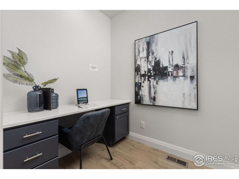 A unique pocket office right off the kitchen can serve many purposes: study, craft room, wine vault, expanded pantry, etc.