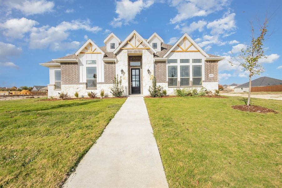 Front exterior of a new home in Ten Mile Creek Estates, DeSoto, TX, highlighting curb appeal (Image 21).