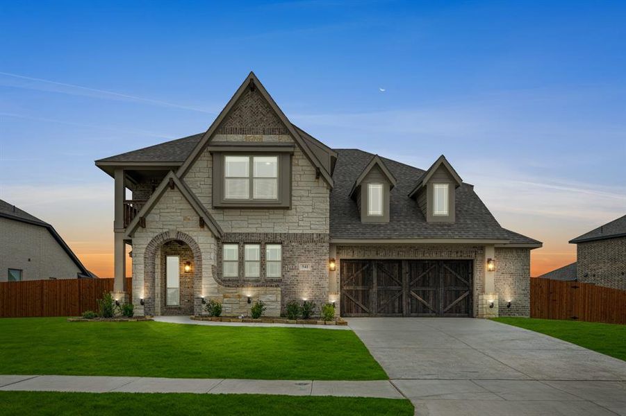 Front exterior of a new home in The Retreat at North Grove 70-75, Waxahachie, TX, highlighting curb appeal (Image 1). Front exterior of a new home in The Retreat at North Grove 70-75, Waxahachie, TX, highlighting curb appeal (Image 1).