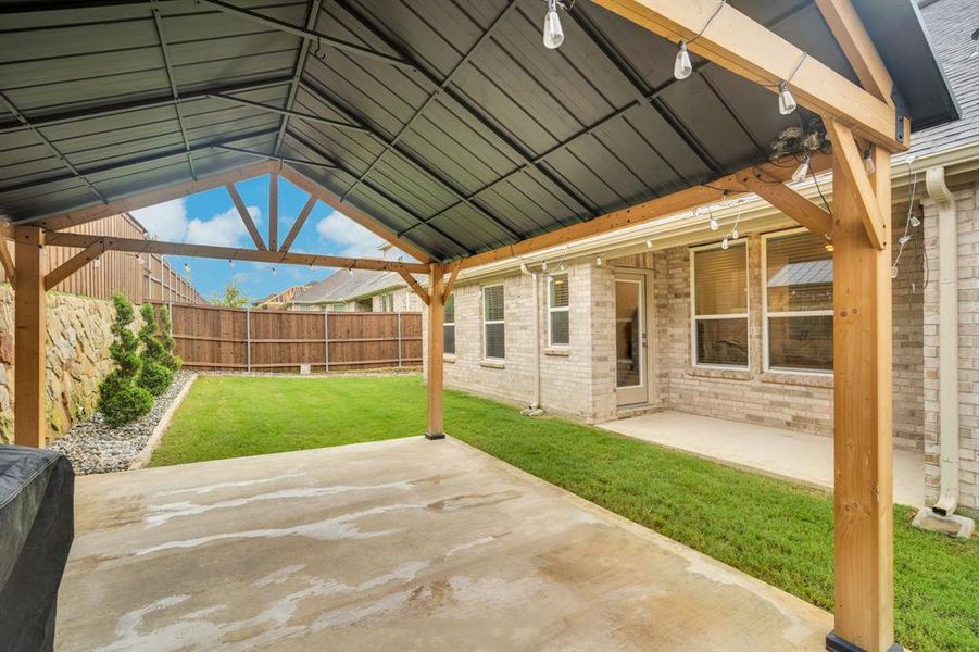 Exterior details and patio area of a home in Westside Preserve, Midlothian (Image 23).
