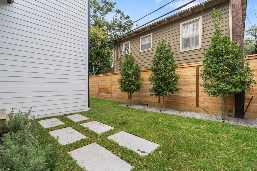 Fabulous back greenspace with beautiful landscaping and room for grill area!