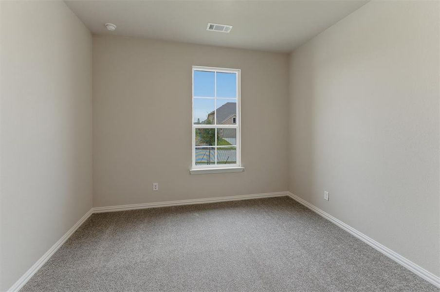 Neutral-toned walls complementing gray carpeting
