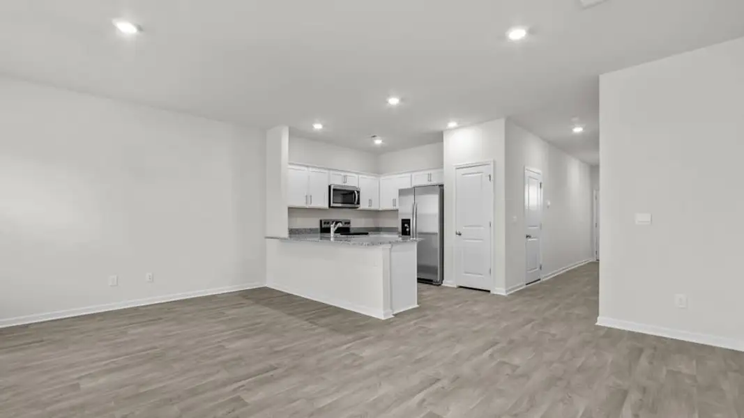 Furnished interior view inside a new home in The Townes at Ridgewood Farms, Winterville (Image 4).