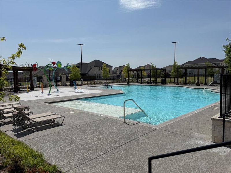 Splash Pad, Tanning Ledge and Pergola Covered Seating Areas Splash Pad, Tanning Ledge and Pergola Covered Seating Areas