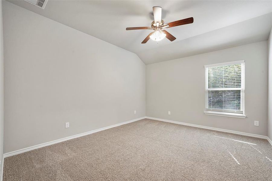 Primary bedroom with nice carpet