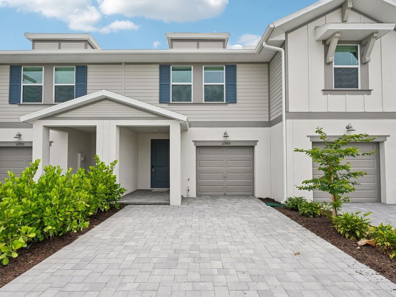 Front exterior of a new home in Meritage Homes at Central Park, Port St. Lucie, FL, highlighting curb appeal (Image 1). Front exterior of a new home in Meritage Homes at Central Park, Port St. Lucie, FL, highlighting curb appeal (Image 1).