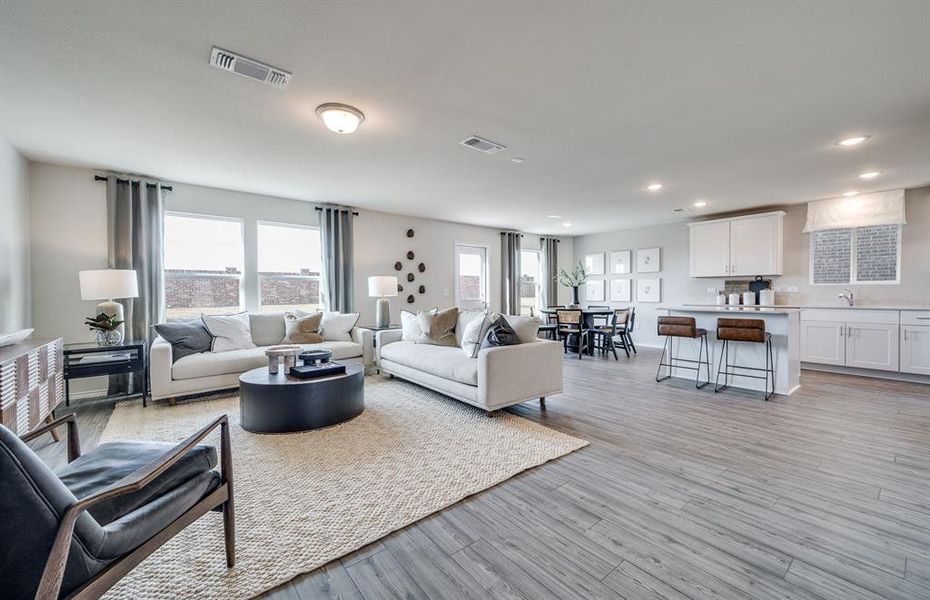 Open concept gathering room creating a spacious and inviting atmosphere *Model representation