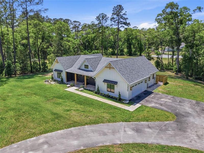 Front exterior of a new home in , Newberry, FL, highlighting curb appeal (Image 28).