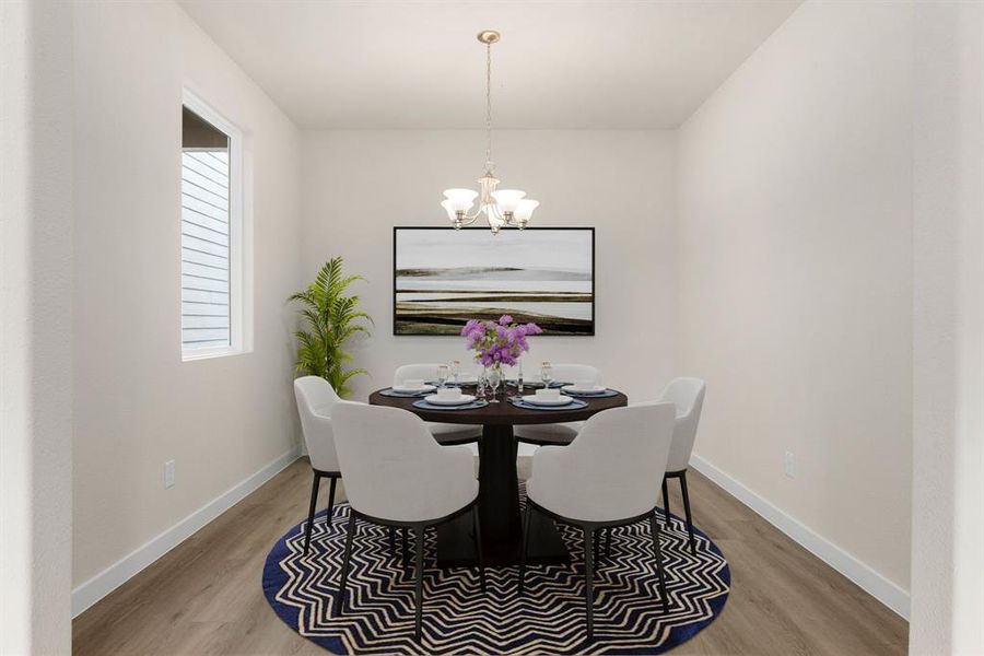 Make memories gathered around the table with your family and friends! This dining room features high ceilings, large window, EVP flooring and a beautiful chandelier.