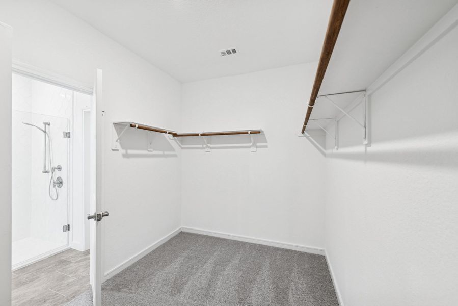 Primary walk-in closet Primary walk-in closet