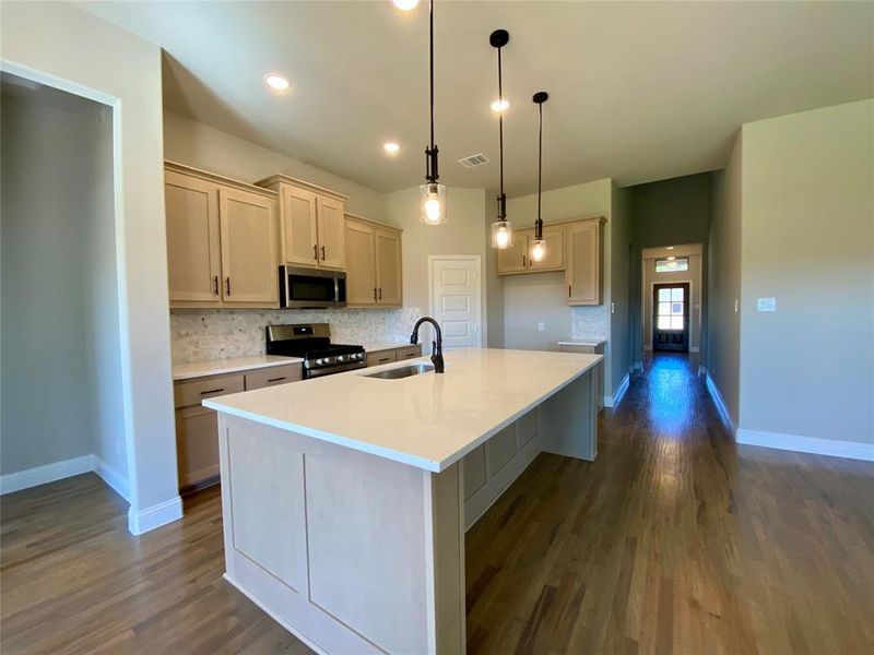 Lightly scraped hardwood floors are a soft Rustic Beige color.