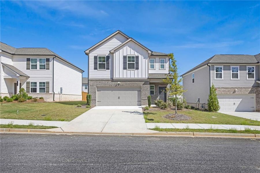 Front exterior of a new home in , Douglasville, GA, highlighting curb appeal (Image 1). Front exterior of a new home in , Douglasville, GA, highlighting curb appeal (Image 1).