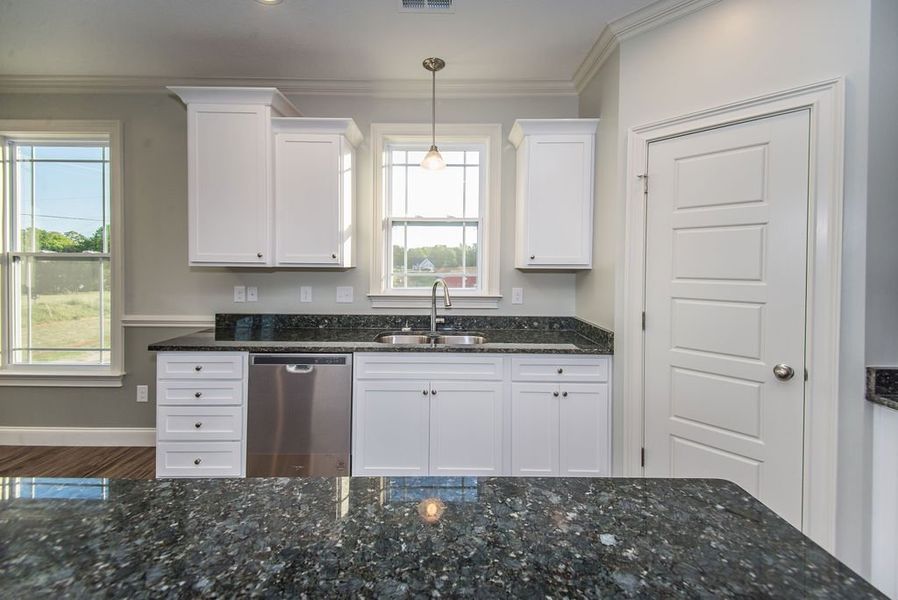 Representative furnished interior of a home built from the Mediterranean by Enchanted Homes in Messer Farms, Inman (Image 13).