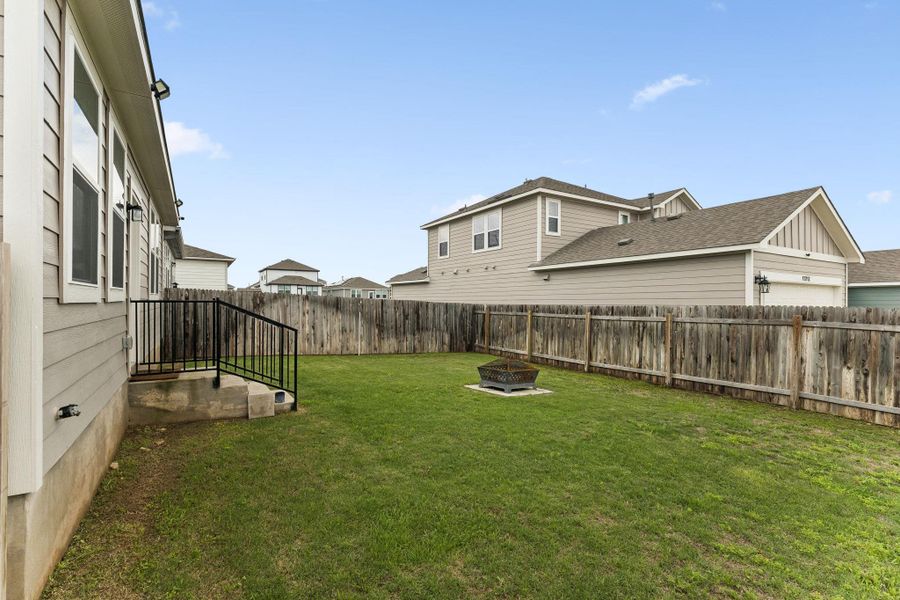 Exterior details and patio area of a home in Stallion Run, Buda (Image 20).