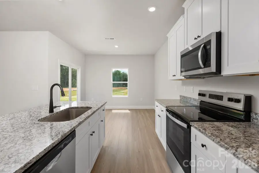 Furnished interior view inside a new home in Ascot Woods, Charlotte (Image 4).