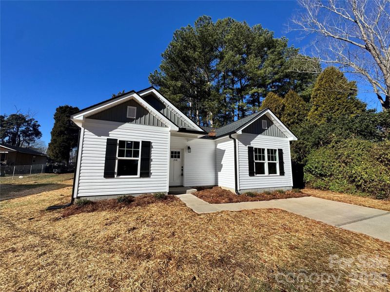 Front exterior of a new home in , Rockwell, NC, highlighting curb appeal (Image 17).