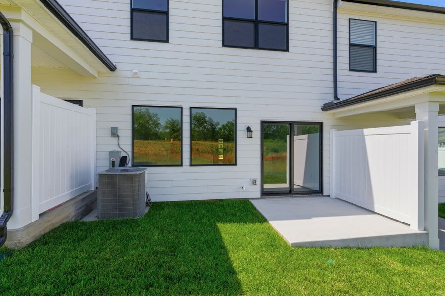 Exterior details and patio area of a home in Nexus Townhomes, Gallatin (Image 4).