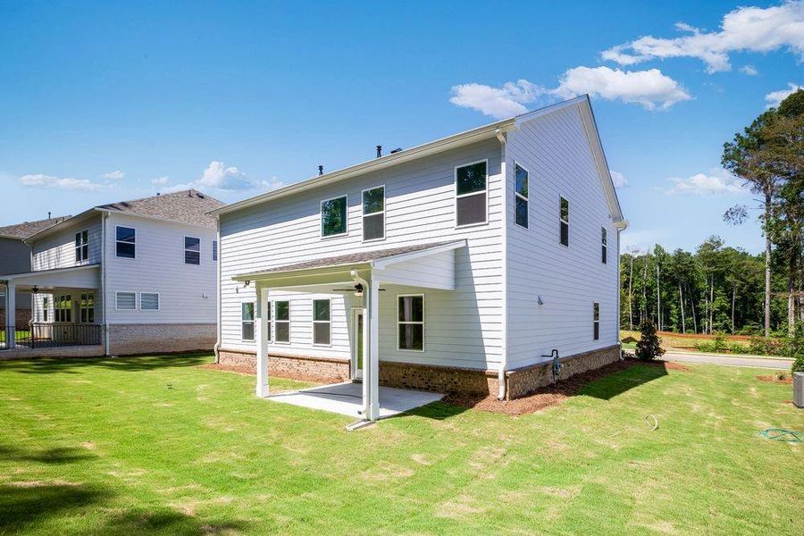 Front exterior of a new home in Bailey Fence, Dacula, GA, highlighting curb appeal (Image 1).