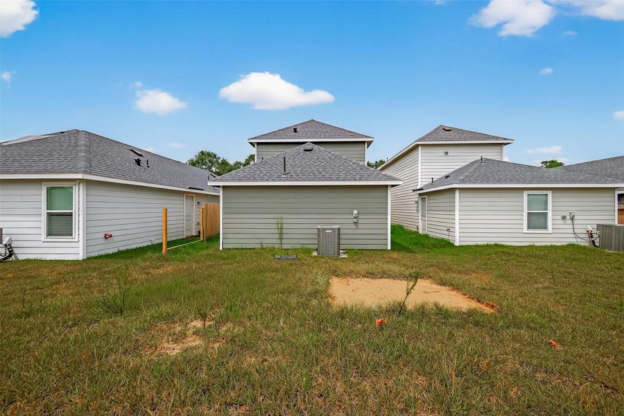 Front exterior of a new home in Marie Village, Conroe, TX, highlighting curb appeal (Image 15). Front exterior of a new home in Marie Village, Conroe, TX, highlighting curb appeal (Image 15).