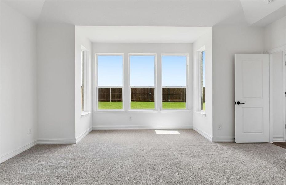 Owners suite with large bay windows