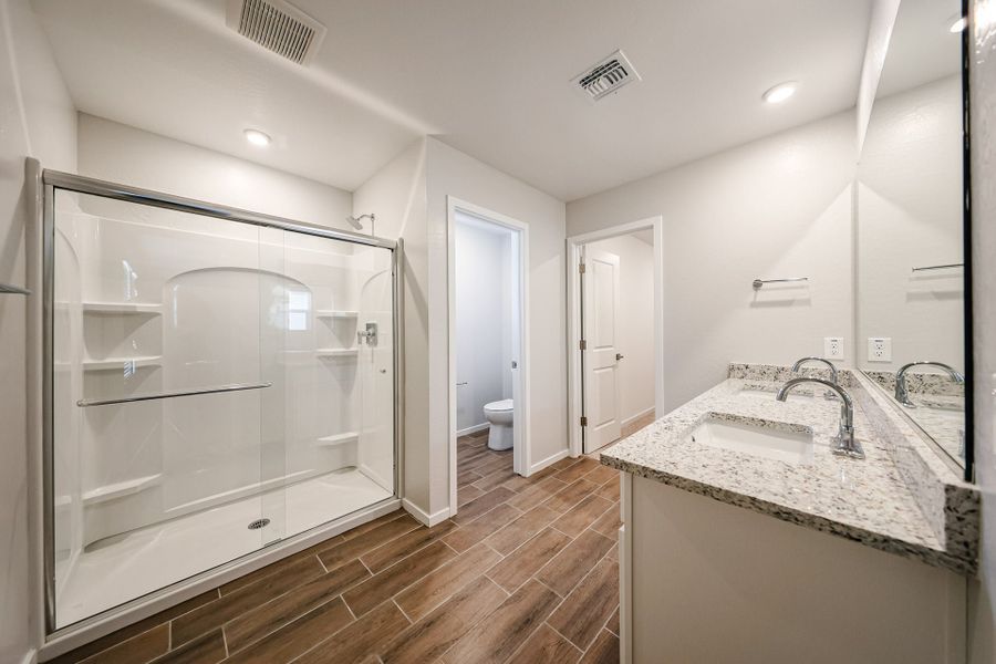 A bathroom with a glass shower.