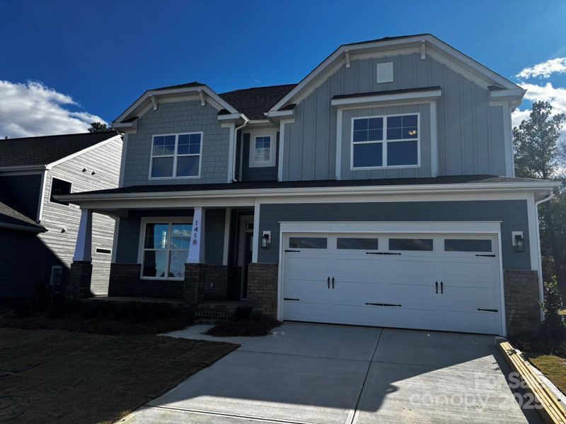 Front exterior of a new home in Waterford Commons, Rock Hill, SC, highlighting curb appeal (Image 1).