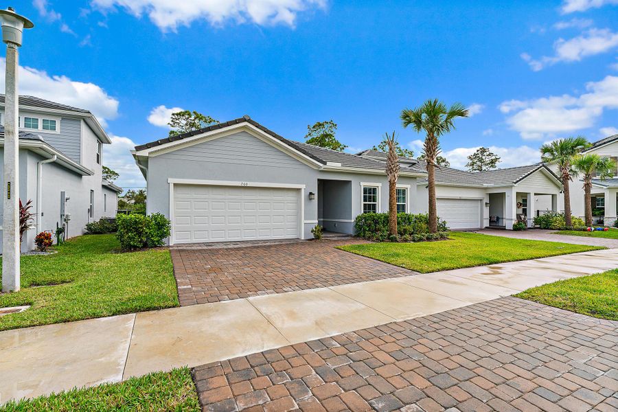 Front exterior of a new home in Banyan Bay, Stuart, FL, highlighting curb appeal (Image 27).